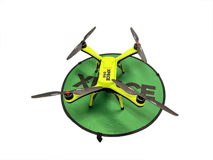 XPECE ONE drone on XPECE foldable green landing pad, portable drone landing mat for takeoff and landing